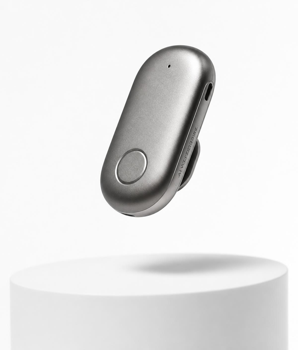 PLAUD NotePin wearable AI note taker shown on a studio pedestal