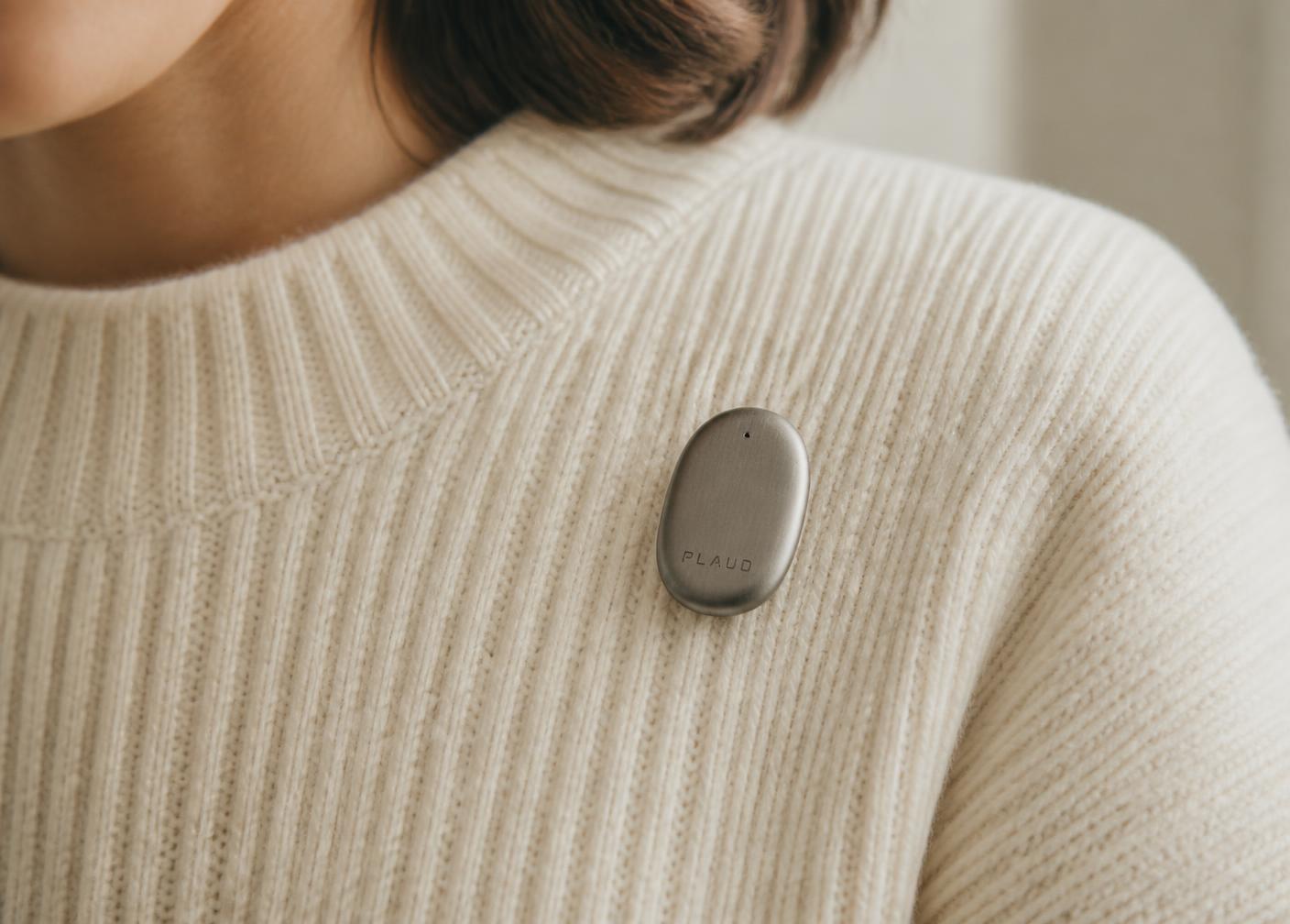 PLAUD NotePin worn clipped to a knitted sweater